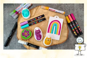 Posca, edding en Faber-Castell MultiMark Acrylic acrylmarkers naast creatieve voorbeelden en een regenboogtekening.