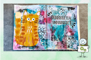 Mixed media art journal pagina met een gele kat en de tekst Purrrfectly impurrrfect